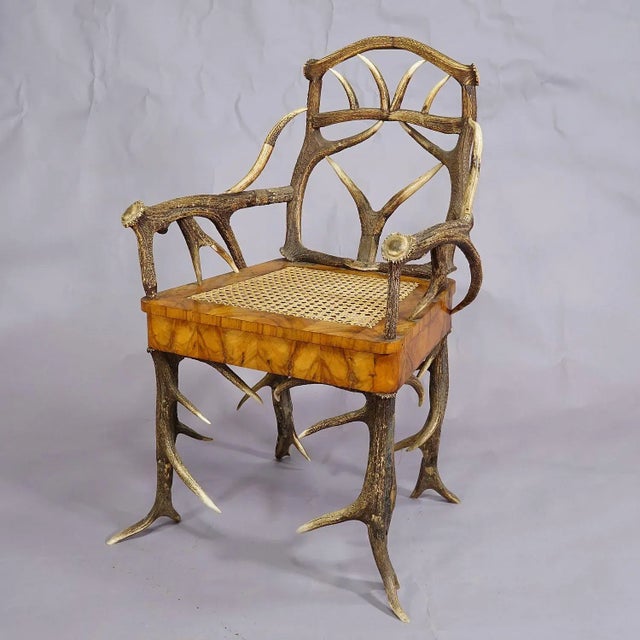 Black Forest Antler Arm Chair by J. A. K. Horn, Turingen 1840s An elaborate antique Black Forest antler arm chair with...