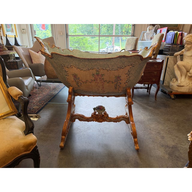 Featuring a dramatic, deeply scalloped boat-shaped sleeping basin, this highly decorative nursery heirloom showcases an...