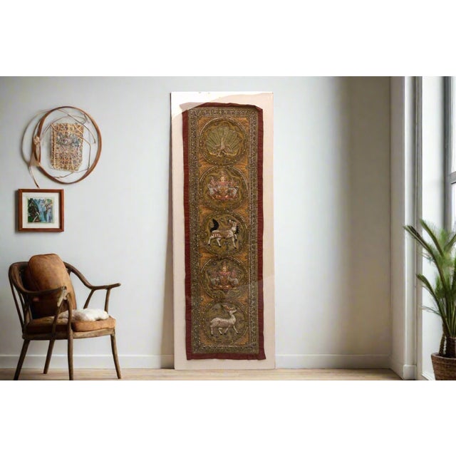 This magnificent tapestry, shimmering with metallic threads and intricate embroidery, embodies the rich artistic...