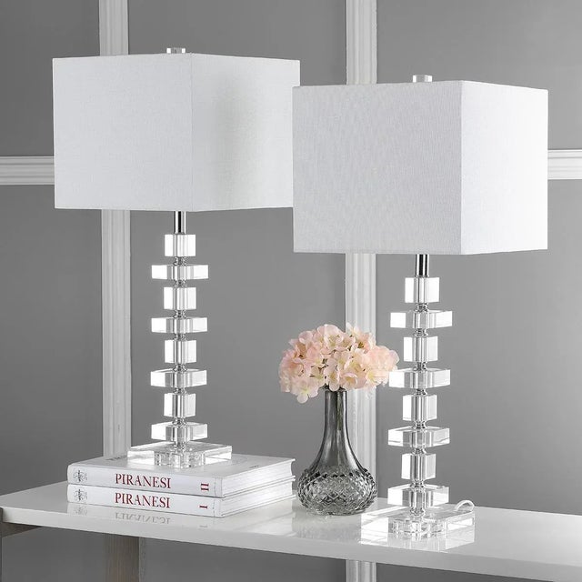 Alternating large and small blocks of solid crystal create a dramatic statement in this set of two Deco Crystal table...
