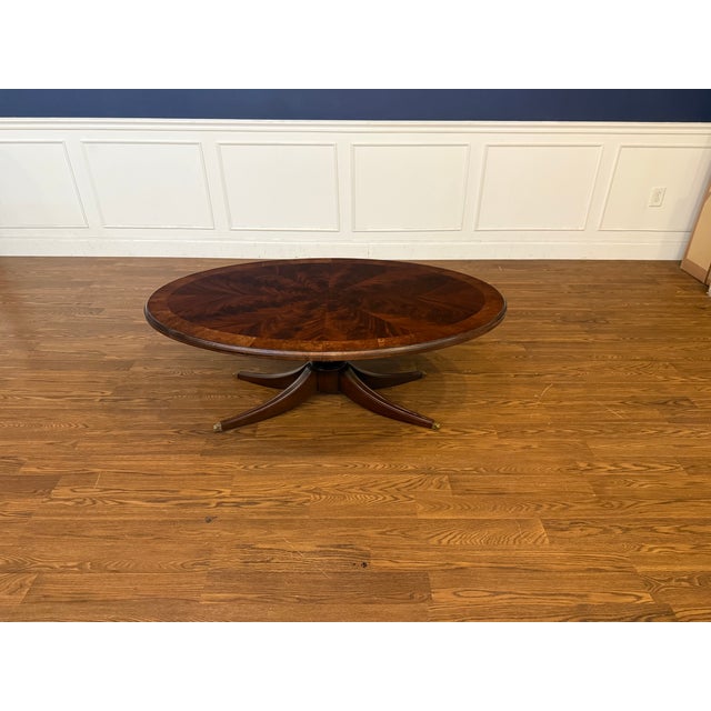 This is oval mahogany cocktail table made to order in the Leighton Hall shop in Suwanee, Georgia. It features a field of...