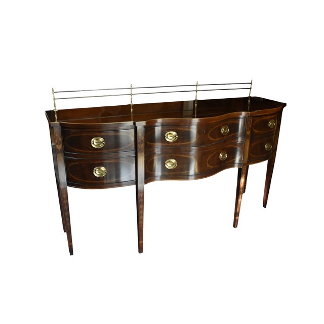 From the Heritage Furniture Heirloom Collection comes this magnificent serpentine sideboard in the classic Hepplewhite...