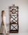 This 1900 - 1909 coat rack from France is finished in chocolate, worked in bamboo. It is distinguished by its mirror, a...