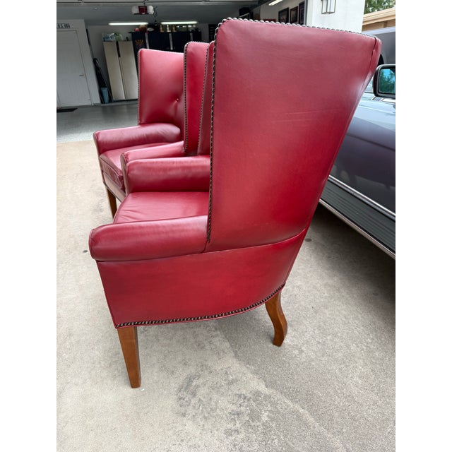 Pair of vintage red leather club chairs with nailhead trim. Leathercraft brand. The inside cushions were replaced with new...