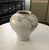 This is white celadon style pottery with cherry flower design. It is very full at the top and tapered narrowly at the...
