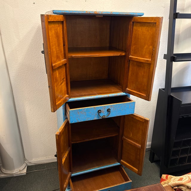 Design Plus Gallery presents a Cerulean Blue Wedding Cabinet. This striking Chinese-style accent cabinet is finished in a...