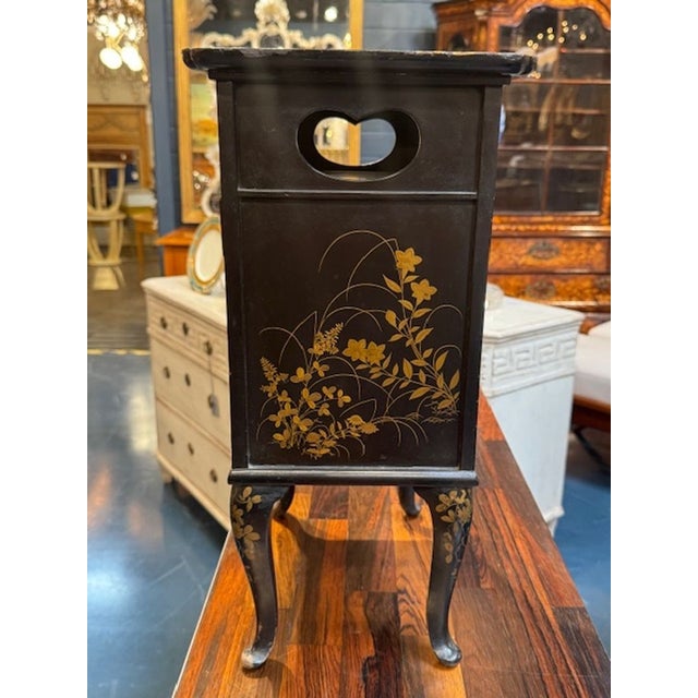The Petite Italian Black Cabinet with Hand Painted Chinoiserie Design is a stylish and elegant piece of furniture. The...