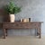 This charming vintage elm wood console is a one-of-a-kind piece with beautiful age and patina that adds character to any...