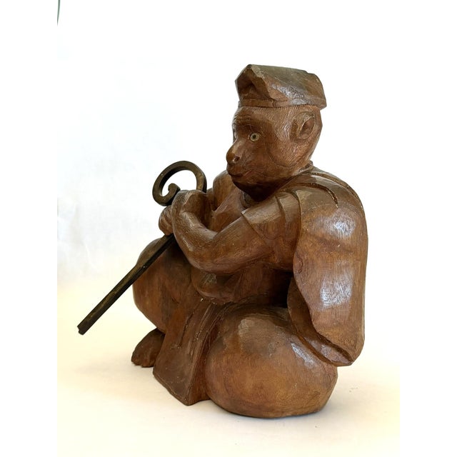 This is a depiction of a monkey dressed in monk's robe and carring a staff made of iron. In Japanese art, monkeys...