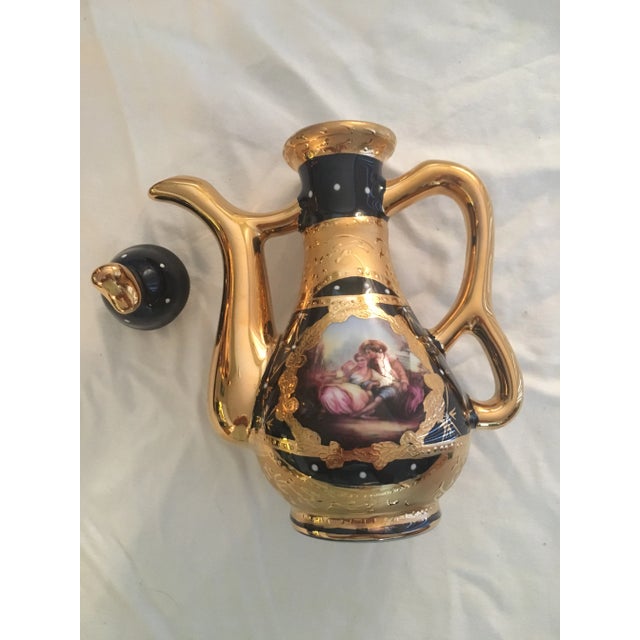 Persian serving set with gold leaf trim. Like new, never used. The set consists of a tray, a round plate, two pitchers...