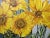 Oil painting on canvas of bold sunflowers. Signed Slater at lower right. Measures 30" x 23.75".