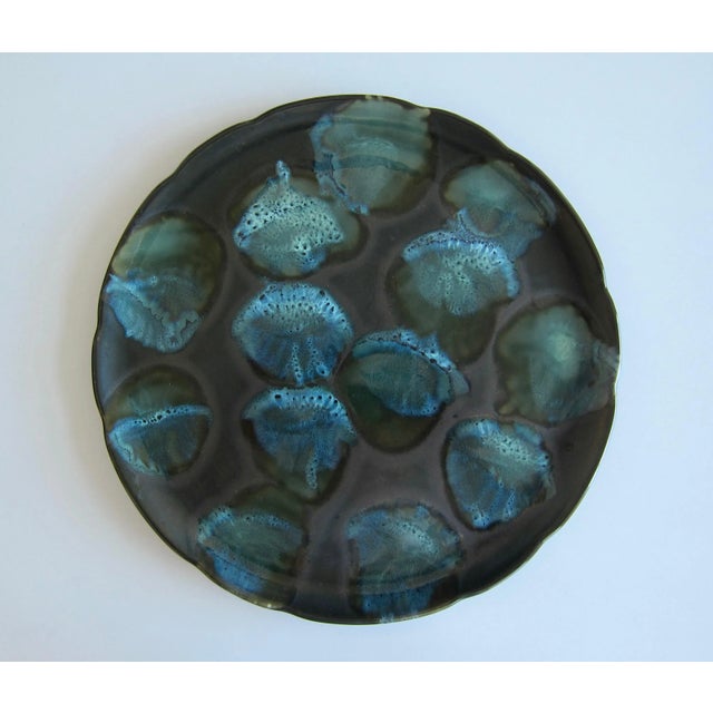 Large arts and crafts colorful ceramic center piece with organic motives, 1950s. Beautiful colors and very refined ceramic...