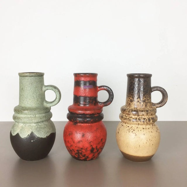 Set of three fat lava art vases Model: Vienna 428 26 Producer: Scheurich, Germany Decade: 1970s Description: These...