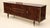 Art Deco style sideboard, circa 1960s, entirely veneered in Macassar ebony with a flamed, reddish-brown-orange grain on a...