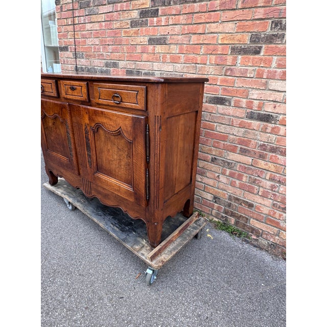 This exquisite antique sideboard is a true testament to the elegance and craftsmanship of French furniture from the 18th...