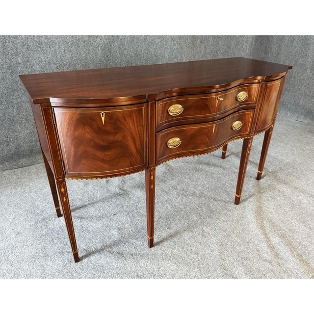 This Henkel Harris Mahogany Inlaid Sideboard No. 2367, still crafted by Henkel Harris today, showcases a solid mahogany...