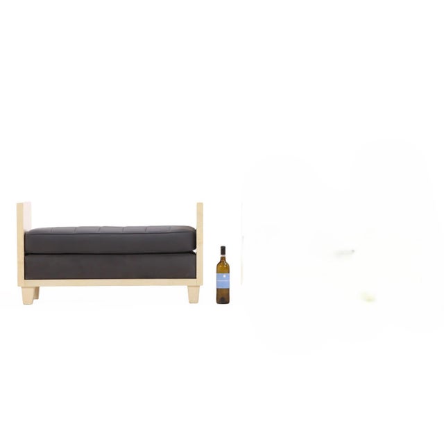 Fully wrapped in warm-toned Pergamino parchment, this bench combines minimalist geometry with luxurious natural texture....