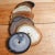 A set of natural stone circular drink place mats or coasters. Likely Agates. France, c1970s. A variety of colours and...