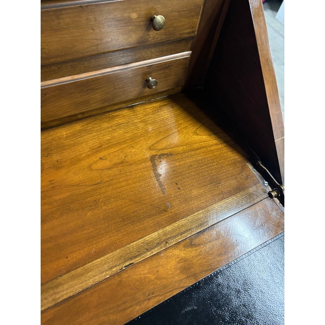 Offered is a vintage solid wood two piece secretary desk with illuminated display hutch. Top portion is removable and...