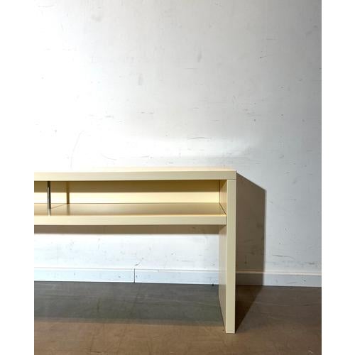Sleek and minimalist console table or TV unit featuring a clean, architectural design. Finished in a soft cream tone, this...
