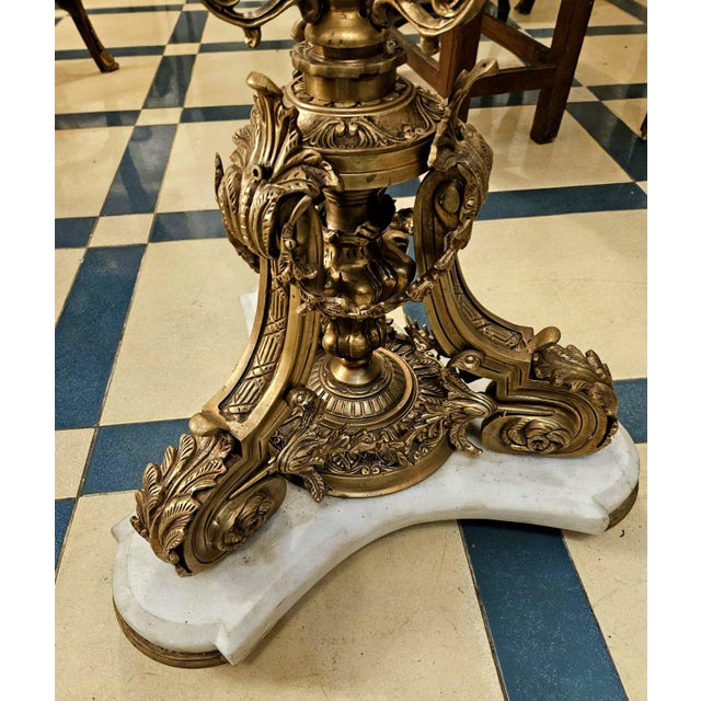 Make a dramatic statement with this extraordinary French Baroque coffee table, featuring a stunning round glass top...
