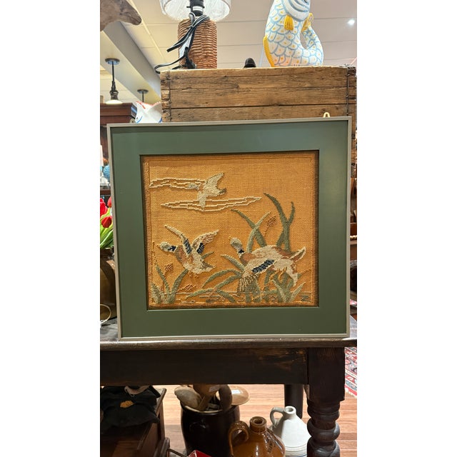A wonderful early Grenfell Industries hooked mat featuring a charming scene of ducks in flight over marsh grasses and...