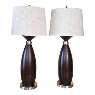 Pair of Contemporary Espresso Wood Hourglass Lamps With Brushed Nickel Accents and Linen Shades For Sale