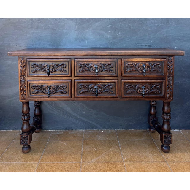 Impressive Spanish Renaissance Revival sideboard crafted in solid oak, dating from 1930. The piece features six drawers...