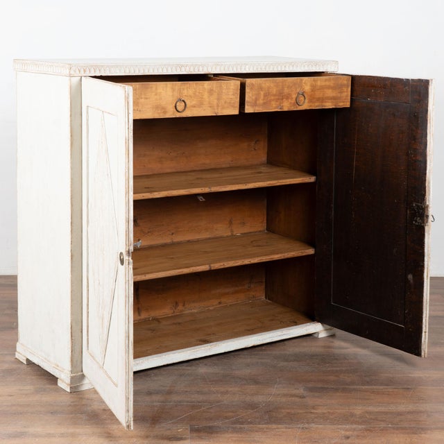 Gustavian white painted pine sideboard or server cabinet with traditional decorative fluted carved diamond panels topped...