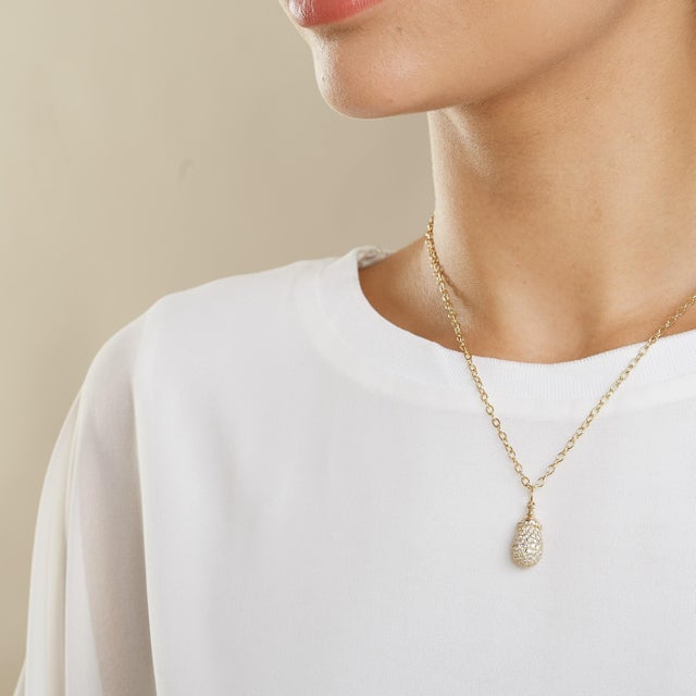 Created in 18kyg Diamonds 1.90 cts approx Chain sold separately Crafted from 18 karat yellow gold, this pendant features...