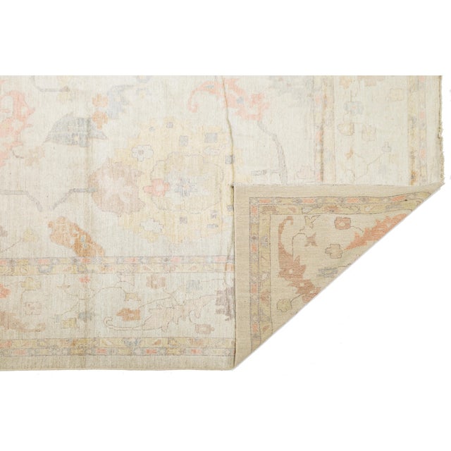 Experience the blend of traditional artistry and contemporary minimalism with this Modern Oushak Style Handmade Wool Rug....