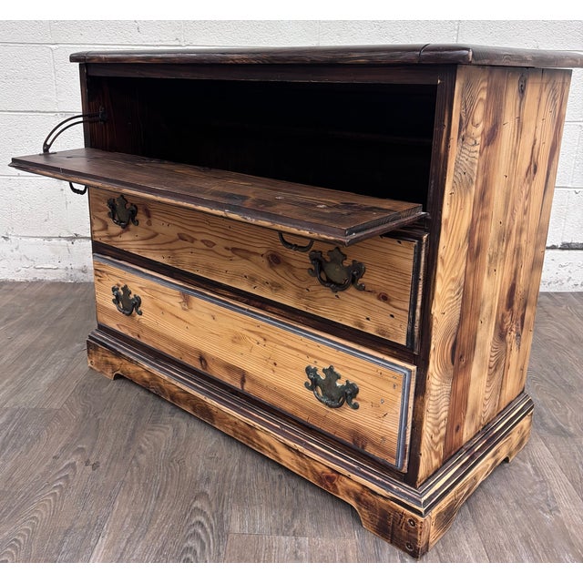 This is a charming vintage solid pine blanket chest featuring a heavily distressed two-tone finish and decorative antiqued...