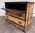 This is a charming vintage solid pine blanket chest featuring a heavily distressed two-tone finish and decorative antiqued...