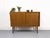 Compact and practical teak sideboard with two smooth-running sliding doors featuring stylish recessed handles. The...