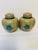 pair of vintage cloisonné ginger jars featuring a blossom and bird motif. Material and Technique: These jars are crafted...