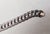 Early 1950s silvertone circular links with etched cloud and star design bracelet with box clasp. Marked "NAPIER."...