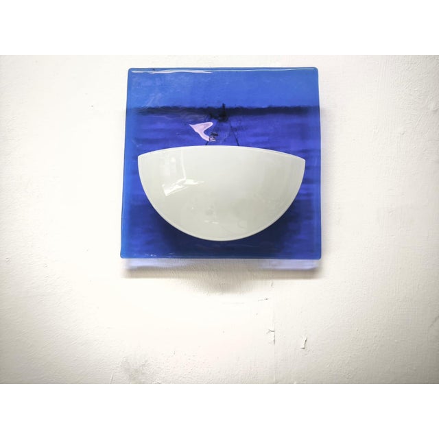 Blue Murano Glass Wall Lamp, 1980s, in Very Good conditions. Designed 1980 to 1989 Up to 250V (Europe/UK Standard).The...
