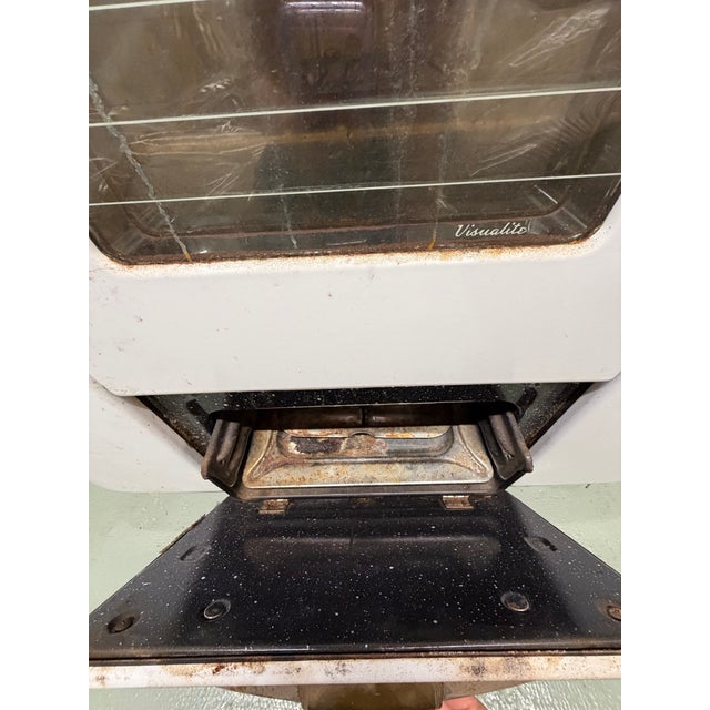 Vintage Tappan Deluxe gas stove from the early 1950s. Original knobs, clock, handles, oven racks, and broiler drawer...