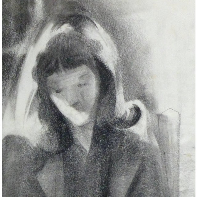 Serene charcoal portrait of a young woman, quietly seated and reading, c. 1990. Original artwork on paper displayed on a...