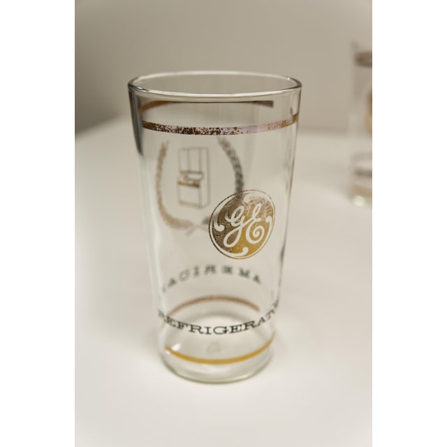 A set of 8 mid-twentieth century modern General Electric glass tumblers featuring the “Americana Refrigerators”...