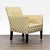 This stylish lounge chair features a bold gold and cream diamond pattern upholstery, offering a modern look perfect for...