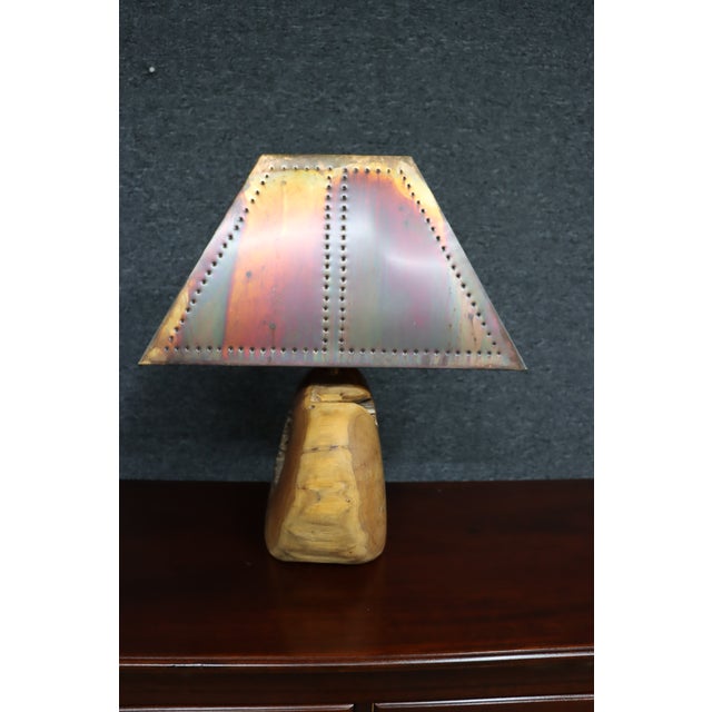 Mid-century modern table lamp featuring a live edge wood base with a natural hollow center and organic form. Paired with a...