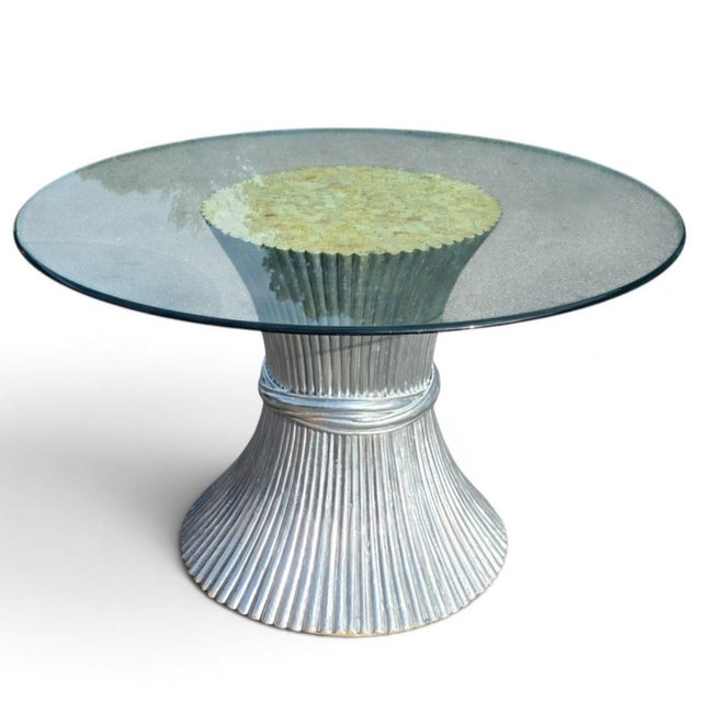 Italian Postmodern dining table featuring a monumental sculptural pedestal with a distinctive hourglass silhouette and...