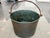 This antique copper cauldron was hand-crafted in France in the 19th Century. It has a hand-forged iron handle and rounded...