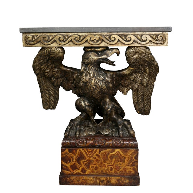 Each with a grey rectangular marble top over a frieze carved with vitruvian scrolls, carved eagle supports sitting on faux...