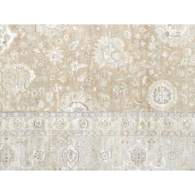 Expertly handwoven in the Tabriz region of Iran, this Vintage Persian Tabriz Rug showcases the rich history and culture of...