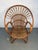 A stylish vintage rattan lounge chair from the 1960s–70s, featuring a relaxed silhouette and warm natural texture. Its...