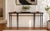 An exceptional Holly Hunt Studio “Rue De Seine” console table featuring a substantial black marble top resting atop a...