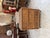 This antique wicker and rattan chest of drawers has been restored and raised on four black metal legs. It has three large,...