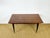 Stunning vintage modernist table from the 1950s, recognizable by its zebrawood veneer, a precious wood prized for its...